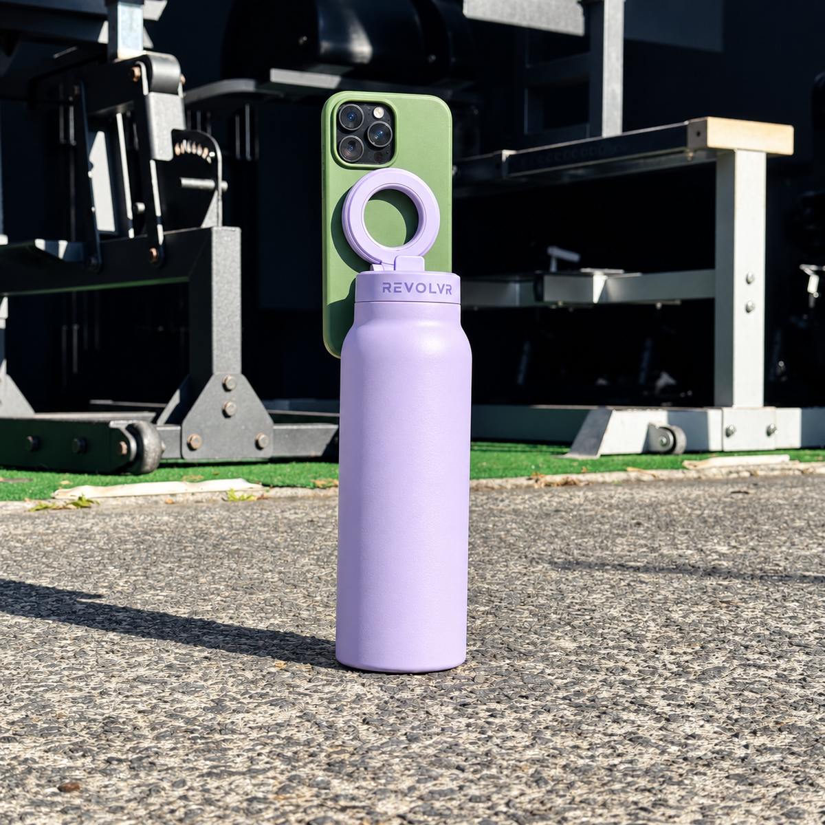 HALO PRO in Lilac standing on gym concrete, an iPhone held on its magnetic lid mount